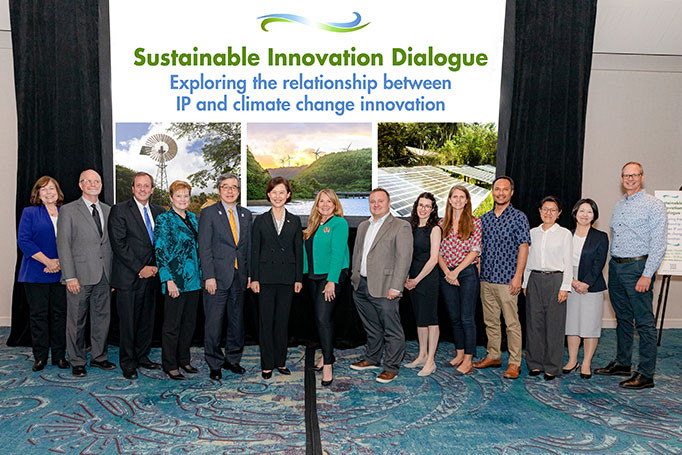 Speakers from the sustainability innovation dialogue at IP5 posing in front of their presentation